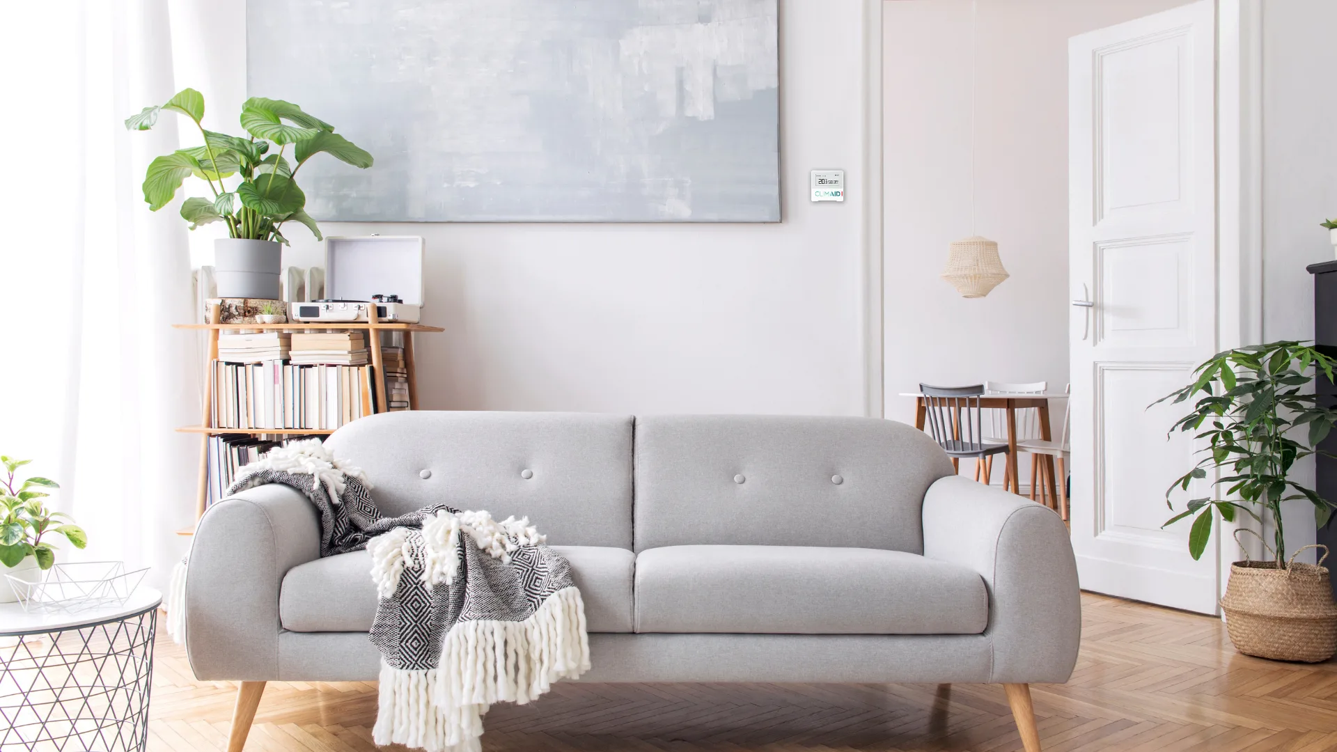 Living room with a CLIMAID sensor on the wall